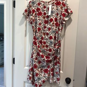 Red/orange/grey floral wrap dress.